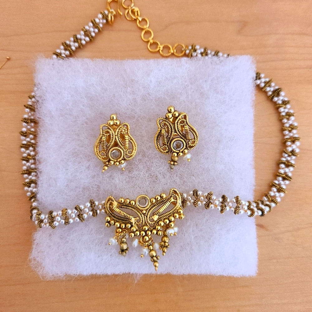 Gold plated on silver necklace and earrings.